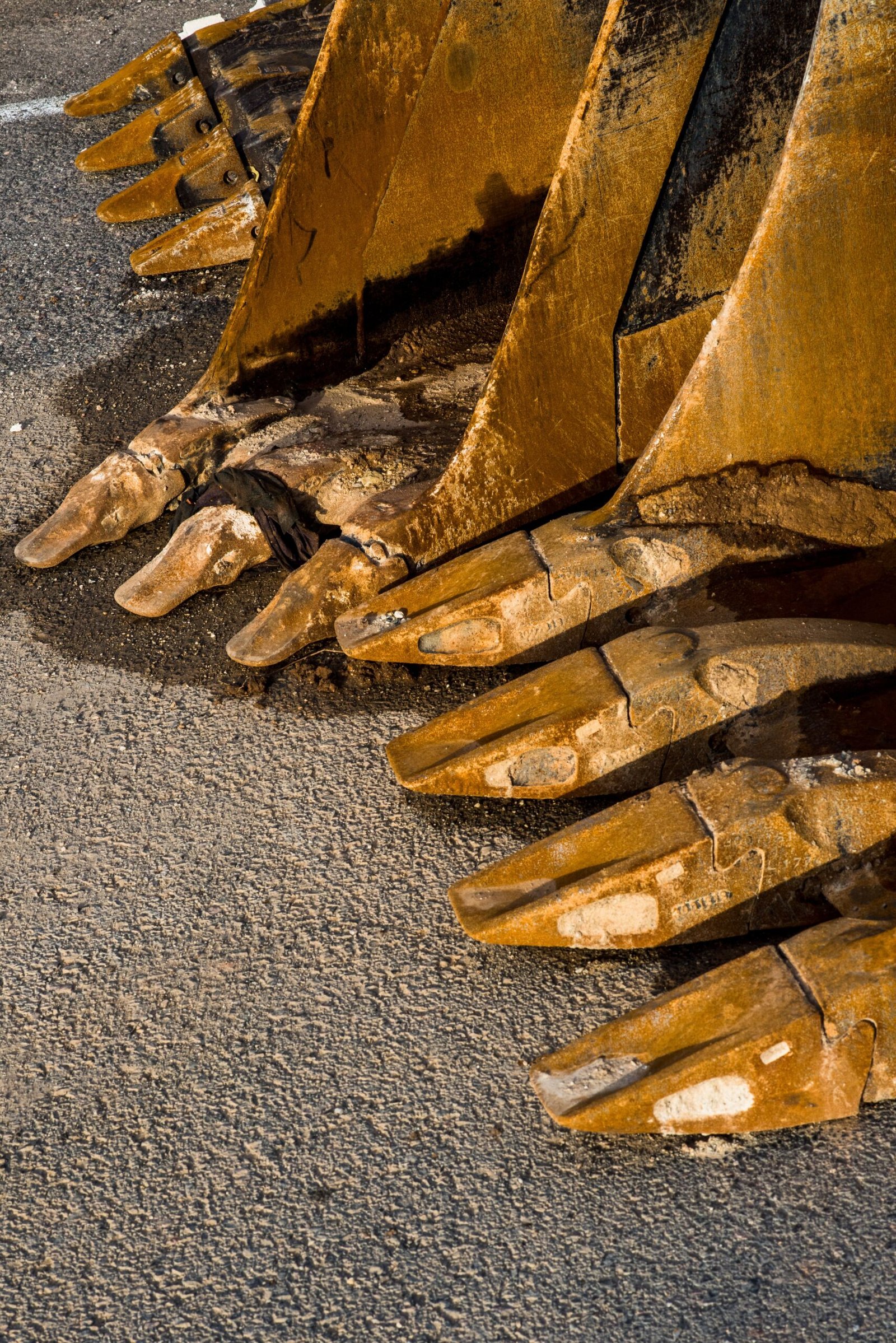 Used excavator bucket fronts with visible teeth and metal surfaces